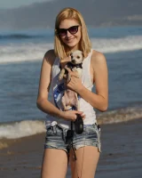 Amateur babe Sloan Kendricks enjoys a day on the beach modeling her swimsuits