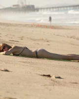 Amateur babe Sloan Kendricks enjoys a day on the beach modeling her swimsuits