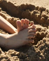 Amateur babe Sloan Kendricks enjoys a day on the beach modeling her swimsuits