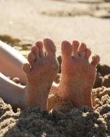 Amateur babe Sloan Kendricks enjoys a day on the beach modeling her swimsuits