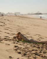 Amateur babe Sloan Kendricks enjoys a day on the beach modeling her swimsuits