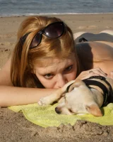 Amateur babe Sloan Kendricks enjoys a day on the beach modeling her swimsuits