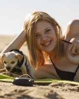 Amateur babe Sloan Kendricks enjoys a day on the beach modeling her swimsuits