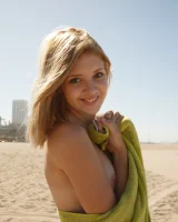 Amateur babe Sloan Kendricks enjoys a day on the beach modeling her swimsuits