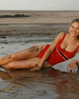 Hottie in a sexy swimsuit Sofia Orlova getting dirty on the beach