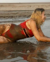 Hottie in a sexy swimsuit Sofia Orlova getting dirty on the beach
