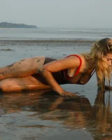 Hottie in a sexy swimsuit Sofia Orlova getting dirty on the beach