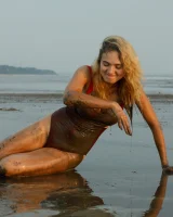 Hottie in a sexy swimsuit Sofia Orlova getting dirty on the beach