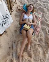 Young sexy goddess Sonia Clarice is in pink bikini with cameltoe and nude showing puffy nipples on the trashy beach