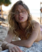 Young sexy goddess Sonia Clarice is in pink bikini with cameltoe and nude showing puffy nipples on the trashy beach