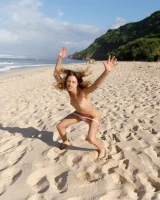 Young sexy goddess Sonia Clarice is in pink bikini with cameltoe and nude showing puffy nipples on the trashy beach