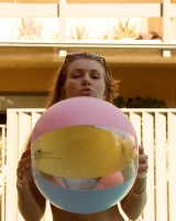 Russian teen Tatiana Penskaya posing in her sexy peach bikini outdoors