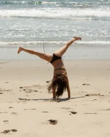 American damsel Tiffany Drake teasing in sexy bikinis on the beach