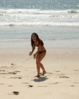 American damsel Tiffany Drake teasing in sexy bikinis on the beach