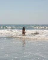 American damsel Tiffany Drake teasing in sexy bikinis on the beach