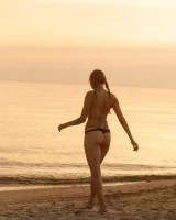 Tasty ass Ulyana Orsk is walking in the garden in tiny pink shorts and in bikini on the beach flashing sexy puffy nipples