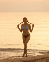 Tasty ass Ulyana Orsk is walking in the garden in tiny pink shorts and in bikini on the beach flashing sexy puffy nipples