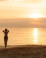 Tasty ass Ulyana Orsk is walking in the garden in tiny pink shorts and in bikini on the beach flashing sexy puffy nipples