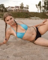 Tasty ass Ulyana Orsk is walking in the garden in tiny pink shorts and in bikini on the beach flashing sexy puffy nipples