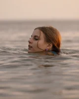 Tasty ass Ulyana Orsk is walking in the garden in tiny pink shorts and in bikini on the beach flashing sexy puffy nipples