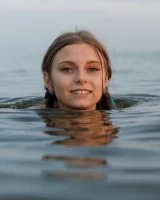 Tasty ass Ulyana Orsk is walking in the garden in tiny pink shorts and in bikini on the beach flashing sexy puffy nipples