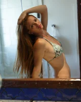 Sexy amateur babe Wendy Patton in a hot bikini shows her big juggs while doing exercises