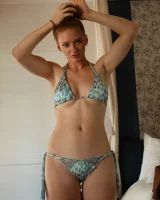 Sexy amateur babe Wendy Patton in a hot bikini shows her big juggs while doing exercises