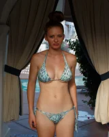 Sexy amateur babe Wendy Patton in a hot bikini shows her big juggs while doing exercises