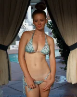 Sexy amateur babe Wendy Patton in a hot bikini shows her big juggs while doing exercises