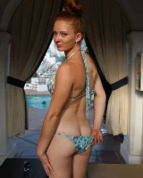 Sexy amateur babe Wendy Patton in a hot bikini shows her big juggs while doing exercises