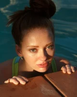 Sexy amateur babe Wendy Patton in a hot bikini shows her big juggs while doing exercises