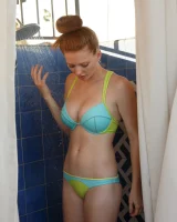 Sexy amateur babe Wendy Patton in a hot bikini shows her big juggs while doing exercises