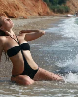 Big boobs baby in black bikini and nude on the beach