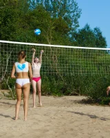 Young nude beach volleyball team