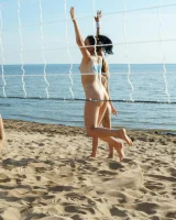 Young nude beach volleyball team