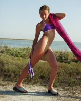 Hairy pussy baby in bikini is nude on the beach