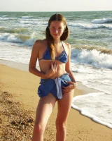 Hairy pussy baby in bikini is nude on the beach