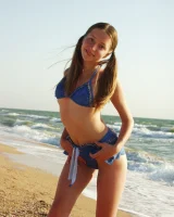 Hairy pussy baby in bikini is nude on the beach