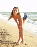 Hairy pussy baby in bikini is nude on the beach