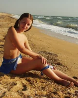 Hairy pussy baby in bikini is nude on the beach