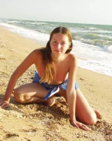 Hairy pussy baby in bikini is nude on the beach