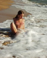 Hairy pussy baby in bikini is nude on the beach
