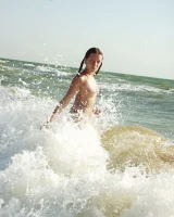 Hairy pussy baby in bikini is nude on the beach