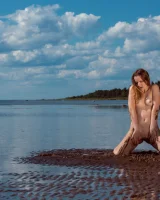 Stripping yellow bikini at the sea