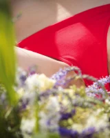 Hot girl in red bikini is nude in the forest river