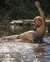 A sexy beauty doesn't need blue micro bikini in the river