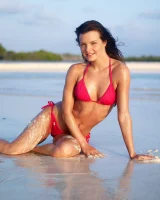 Puffy nipples passionate brunette in red bikini strips in the lake water