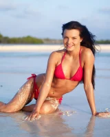 Puffy nipples passionate brunette in red bikini strips in the lake water