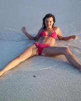 Puffy nipples passionate brunette in red bikini strips in the lake water