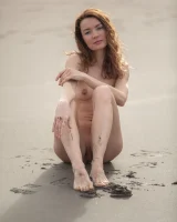 Perfect body girl in black bikini is nude on the beach with erected nipples